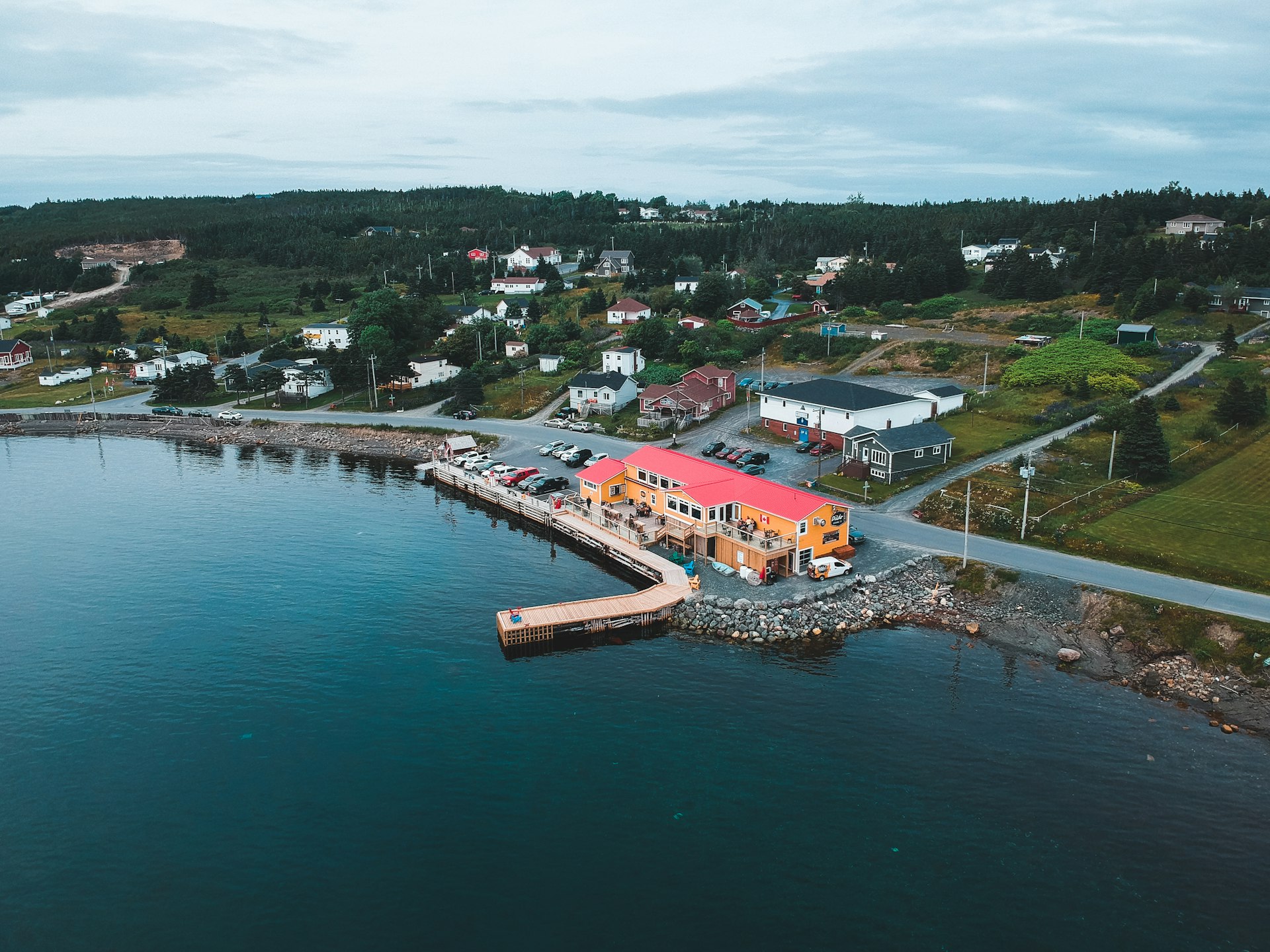 aerial view of city near body of water during daytime